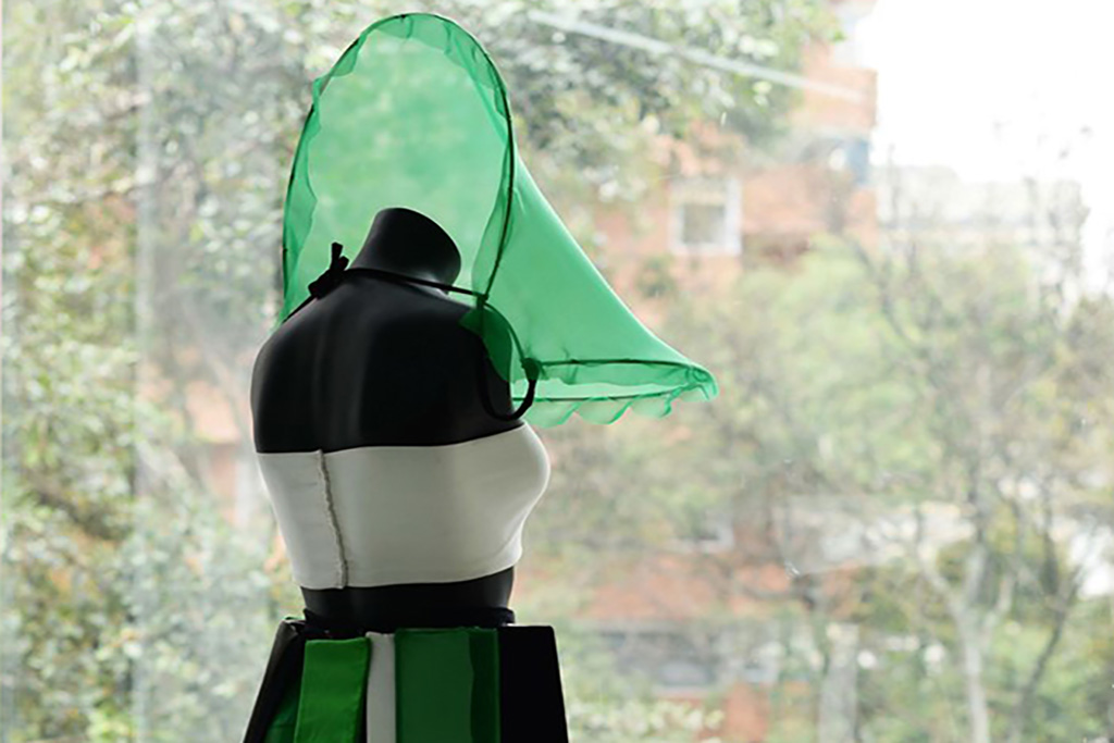 detail shot of a dress with green screen fabric and other green materials